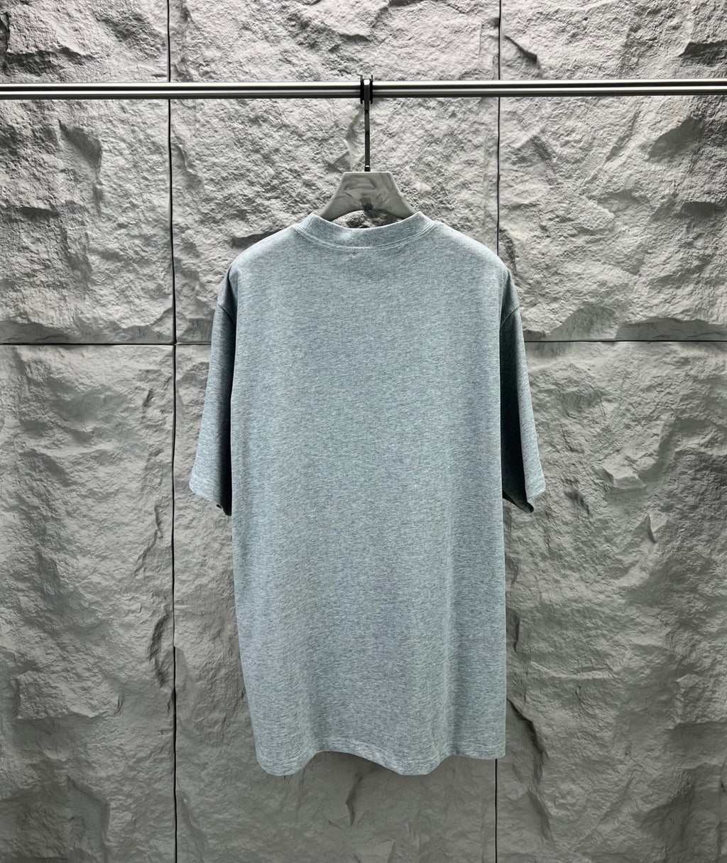 Light blue short-sleeve T-shirt on hanger, crew neck and relaxed straight silhouette