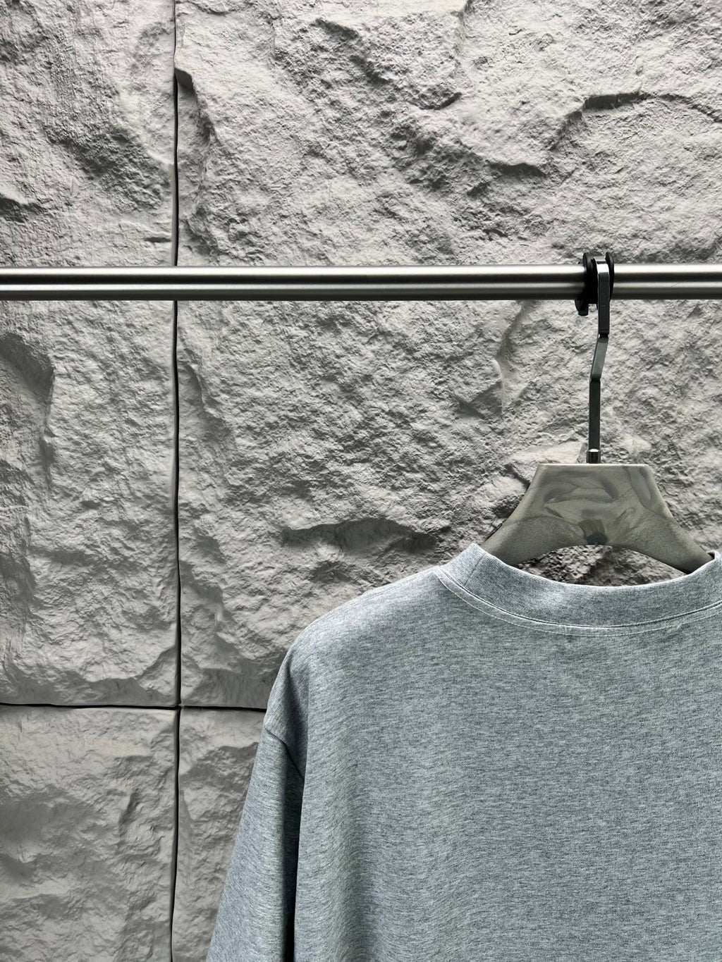 Light blue short-sleeve T-shirt with crew neck, back view