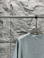 Light blue short-sleeve T-shirt with crew neck, back view