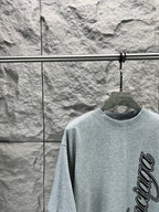 Light blue short-sleeve T-shirt with crew neck and partial Balenciaga logo graphic