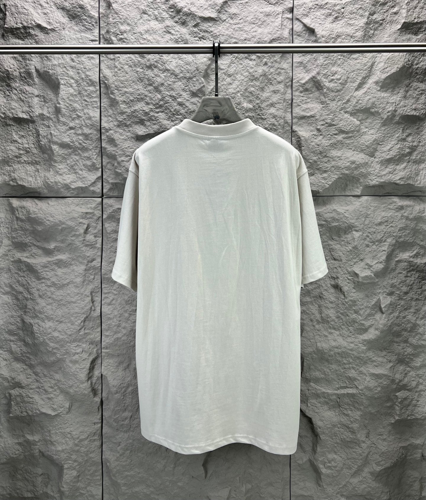 Light gray short-sleeve T-shirt, plain back view on hanger