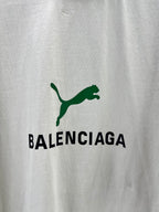 Light gray T-shirt close-up of green Balenciaga logo print