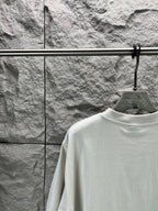 Light gray short-sleeve T-shirt neckline and upper back on hanger