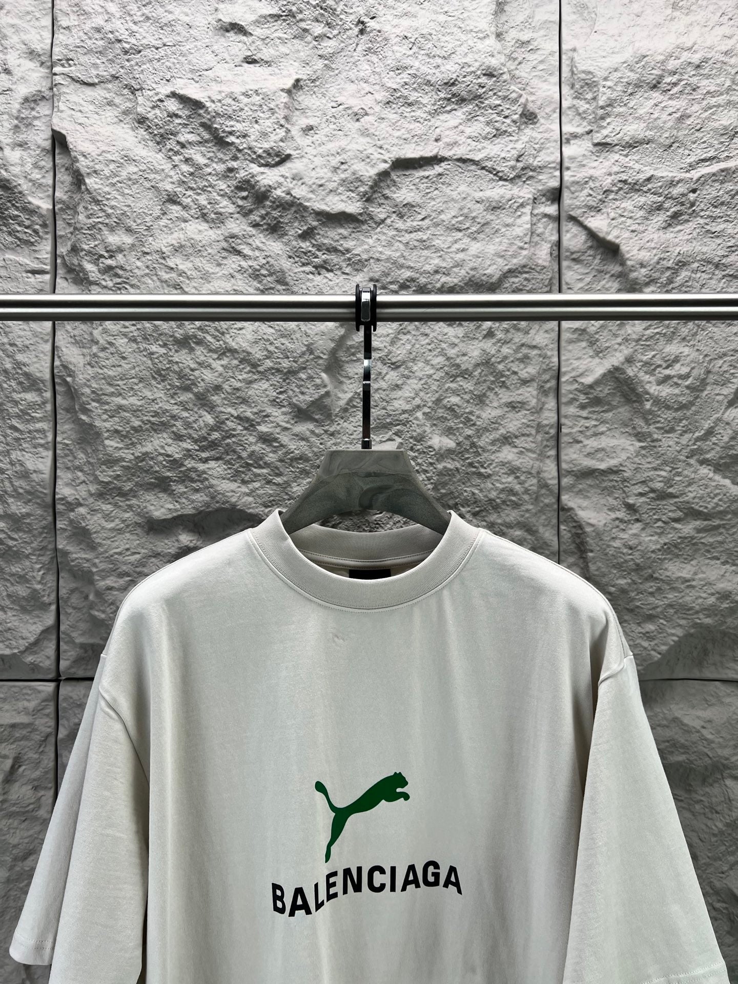 Light gray short-sleeve T-shirt with green puma-style and BALENCIAGA logo