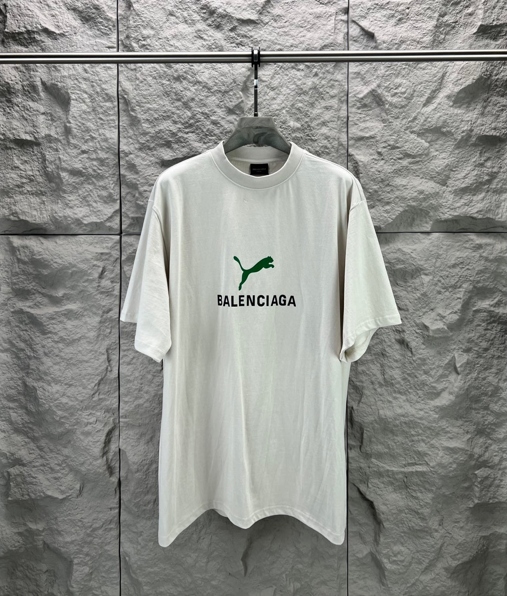 Light gray short-sleeve T-shirt with green Balenciaga logo on front