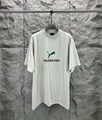 Light gray short-sleeve T-shirt with green Balenciaga logo on front