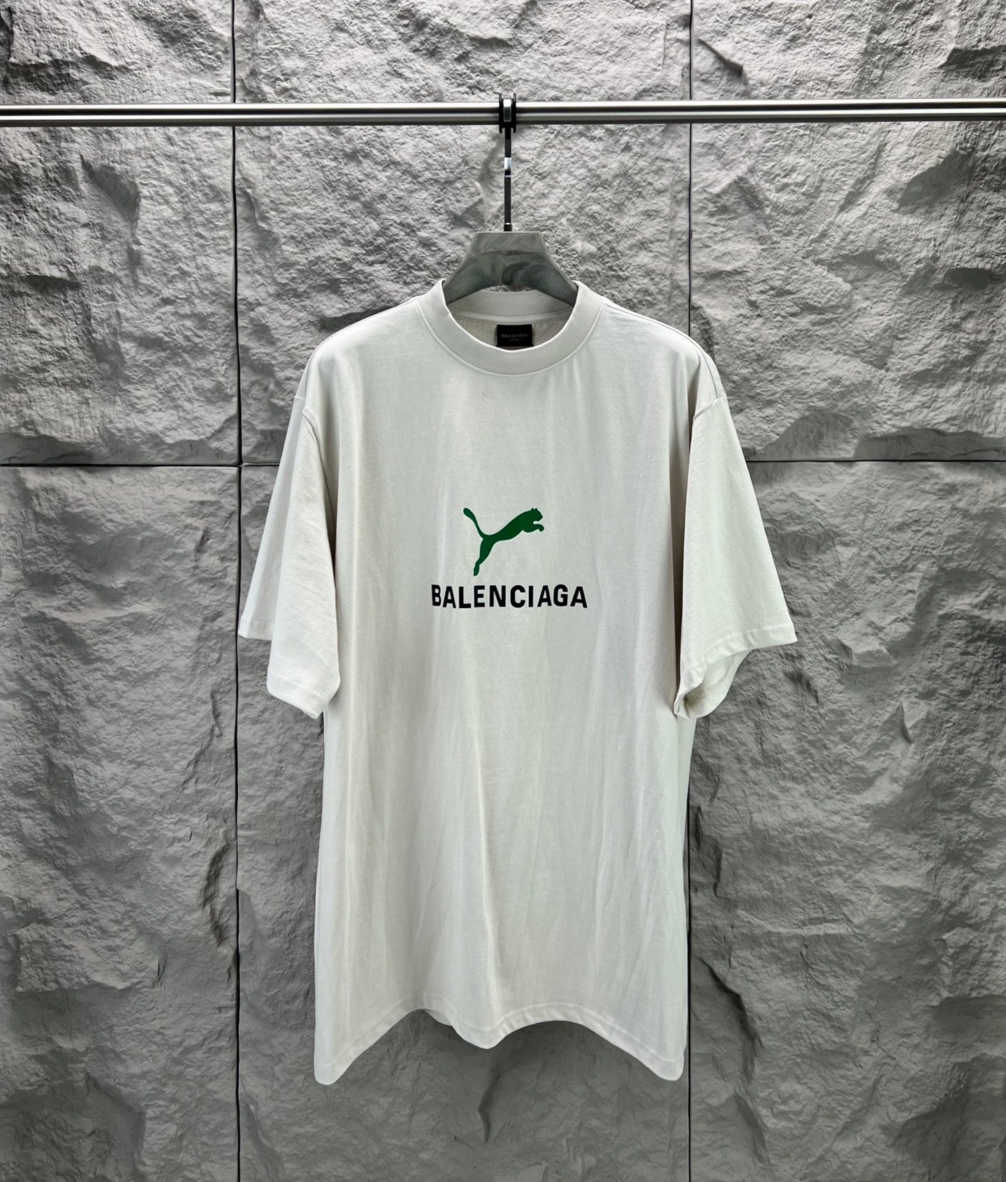 Light gray short-sleeve T-shirt with green Balenciaga logo on front