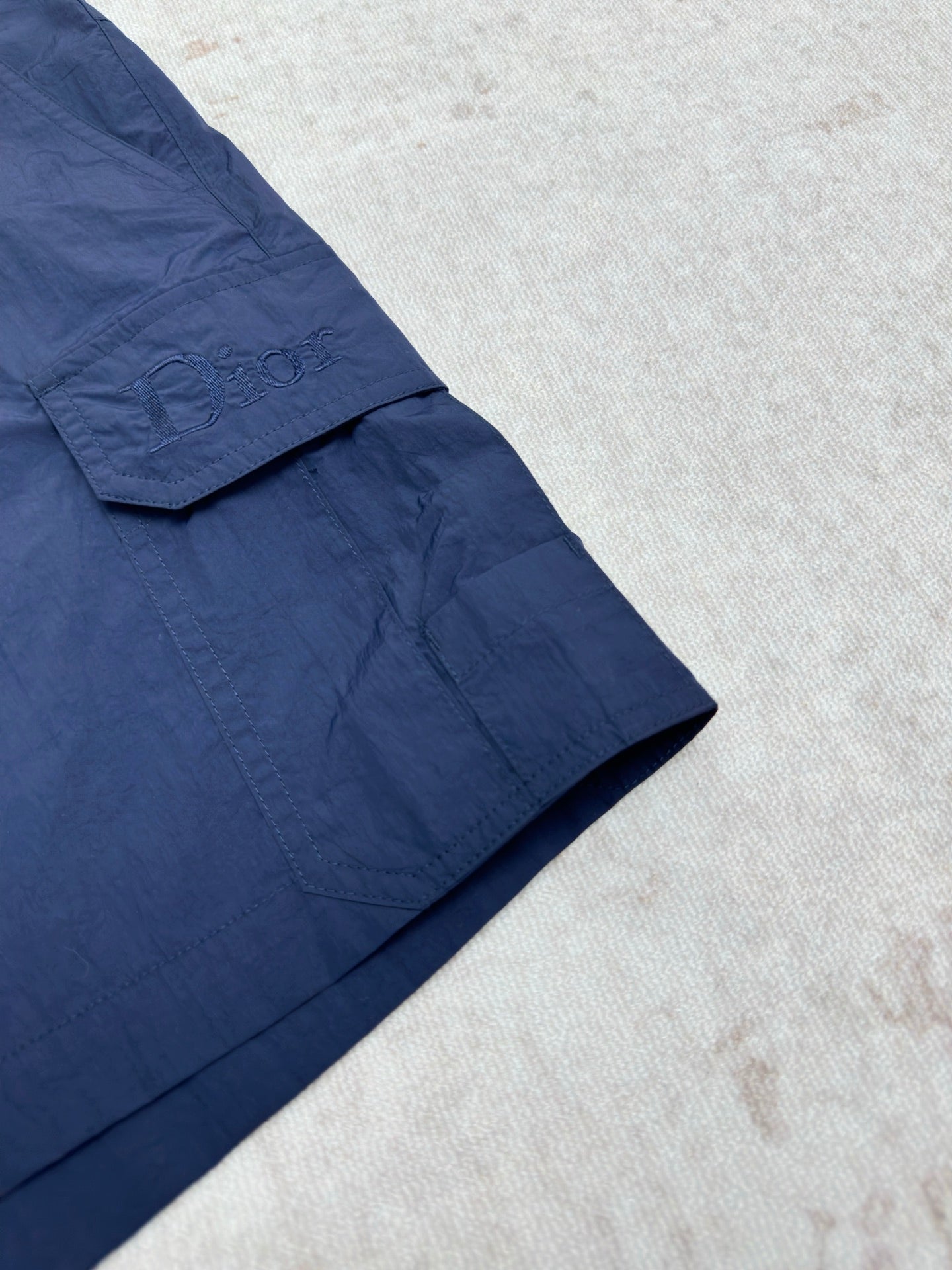 Dior blue short pants with flap pocket detail and angled seam
