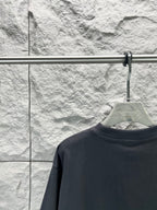 Balenciaga dark navy T-shirt back view, crew neck on hanger