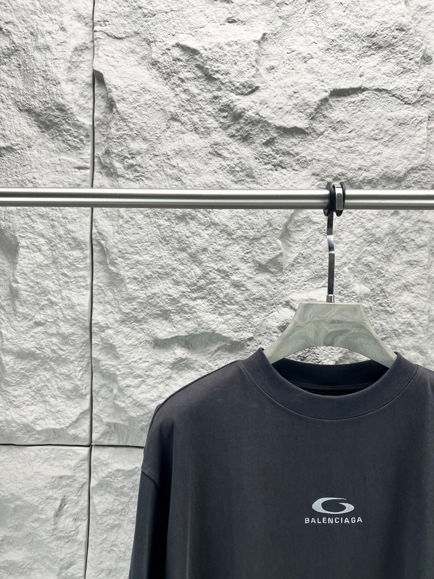 Balenciaga dark navy T-shirt close-up, crew neck and chest logo