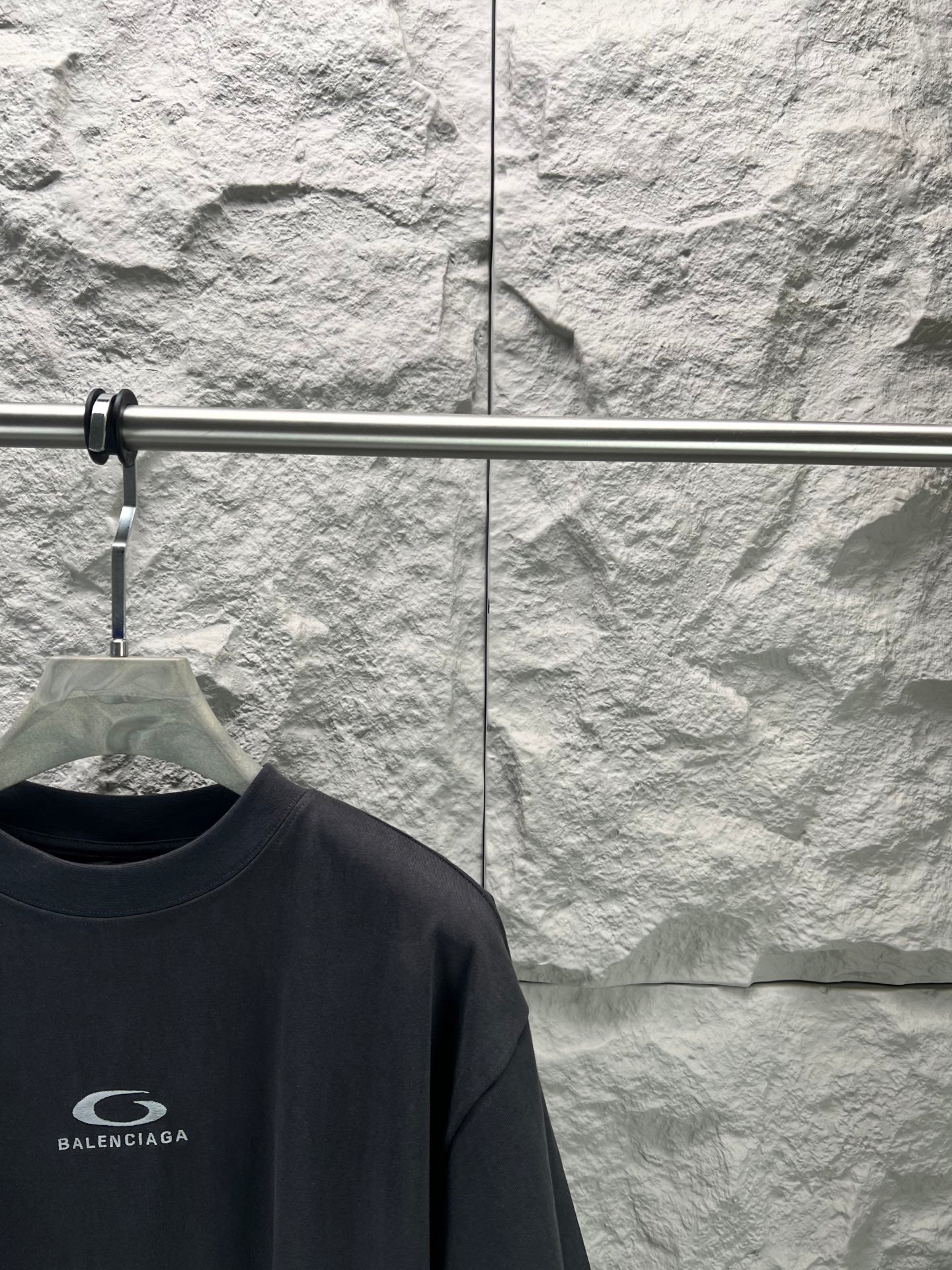 Balenciaga dark navy T-shirt close-up, chest logo on front