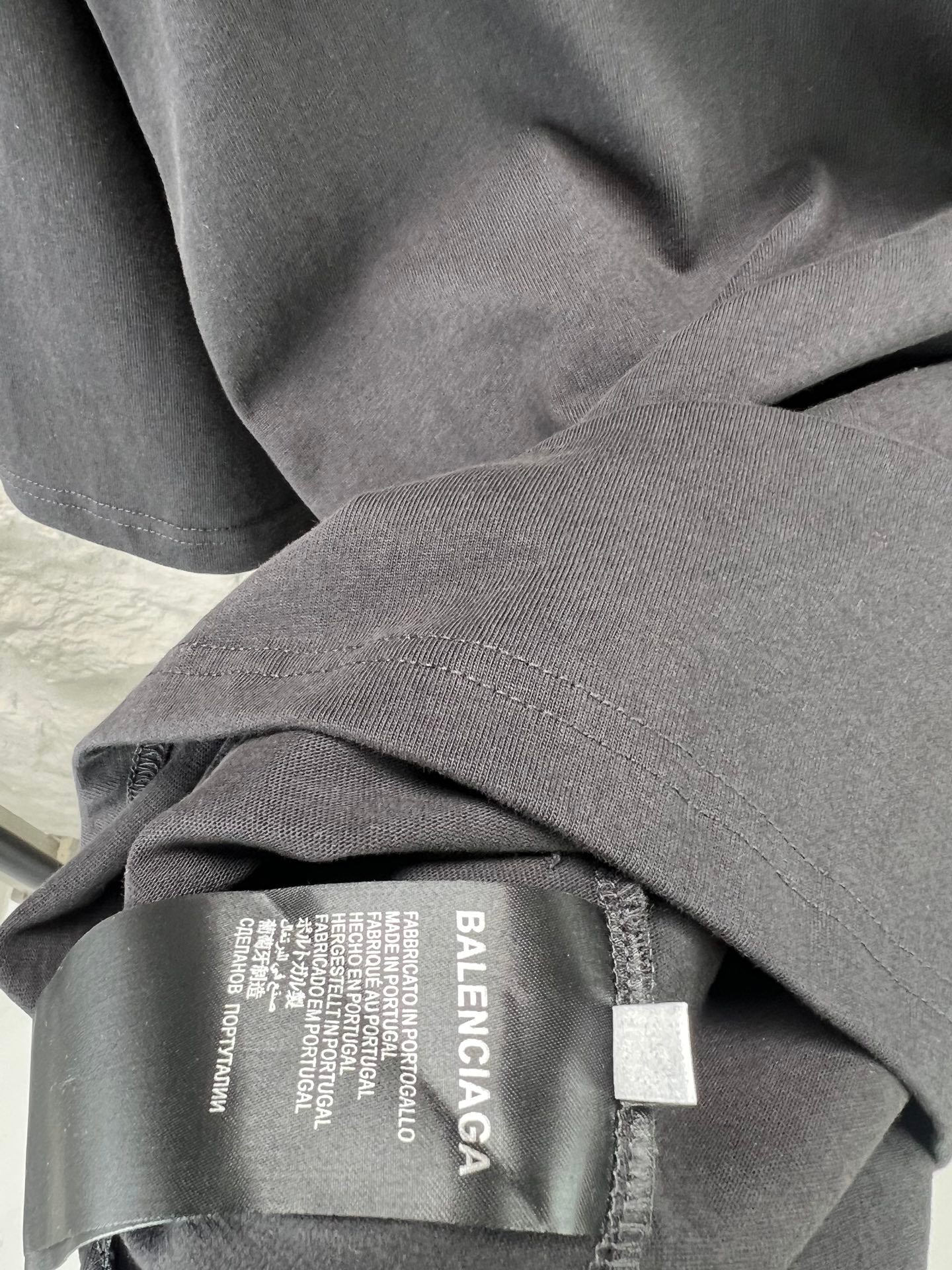 Balenciaga T-shirt fabric and care label near collar seam