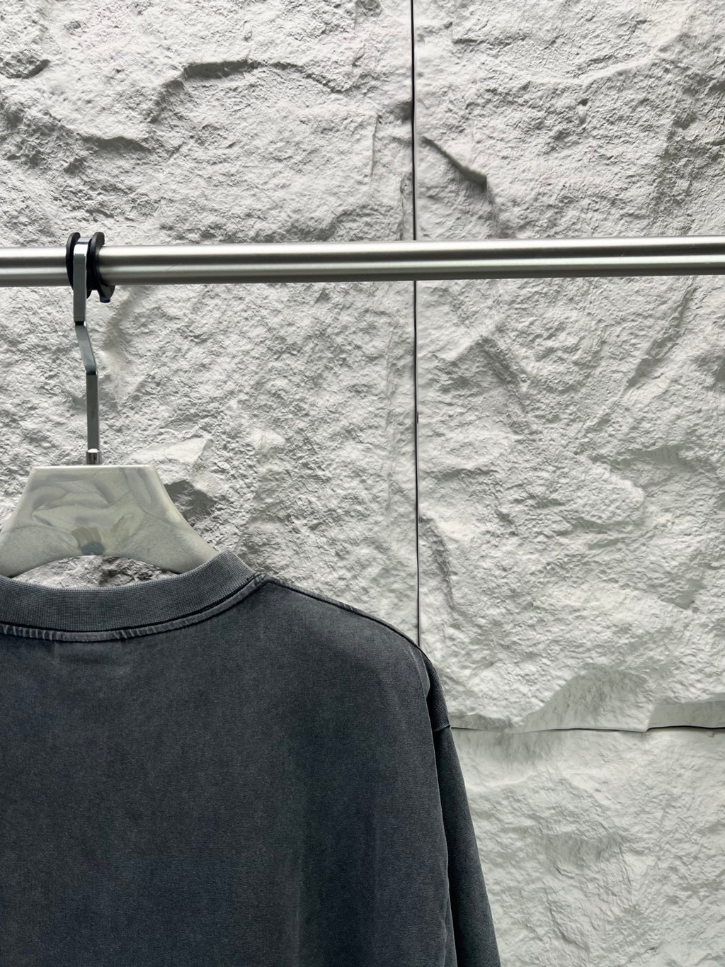 Dark short-sleeve T-shirt close-up of upper back with crew neckline