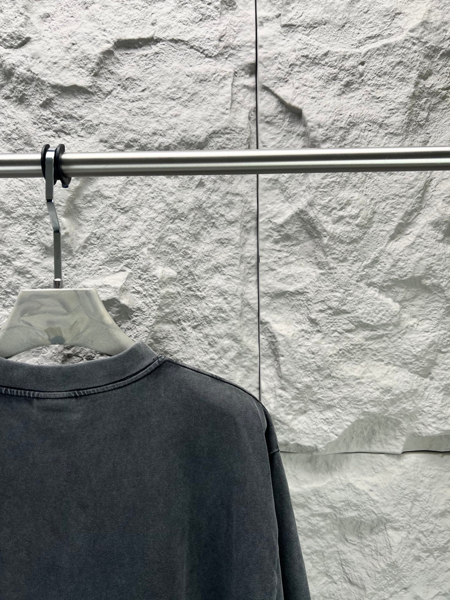 Dark short-sleeve T-shirt close-up of upper back with crew neckline