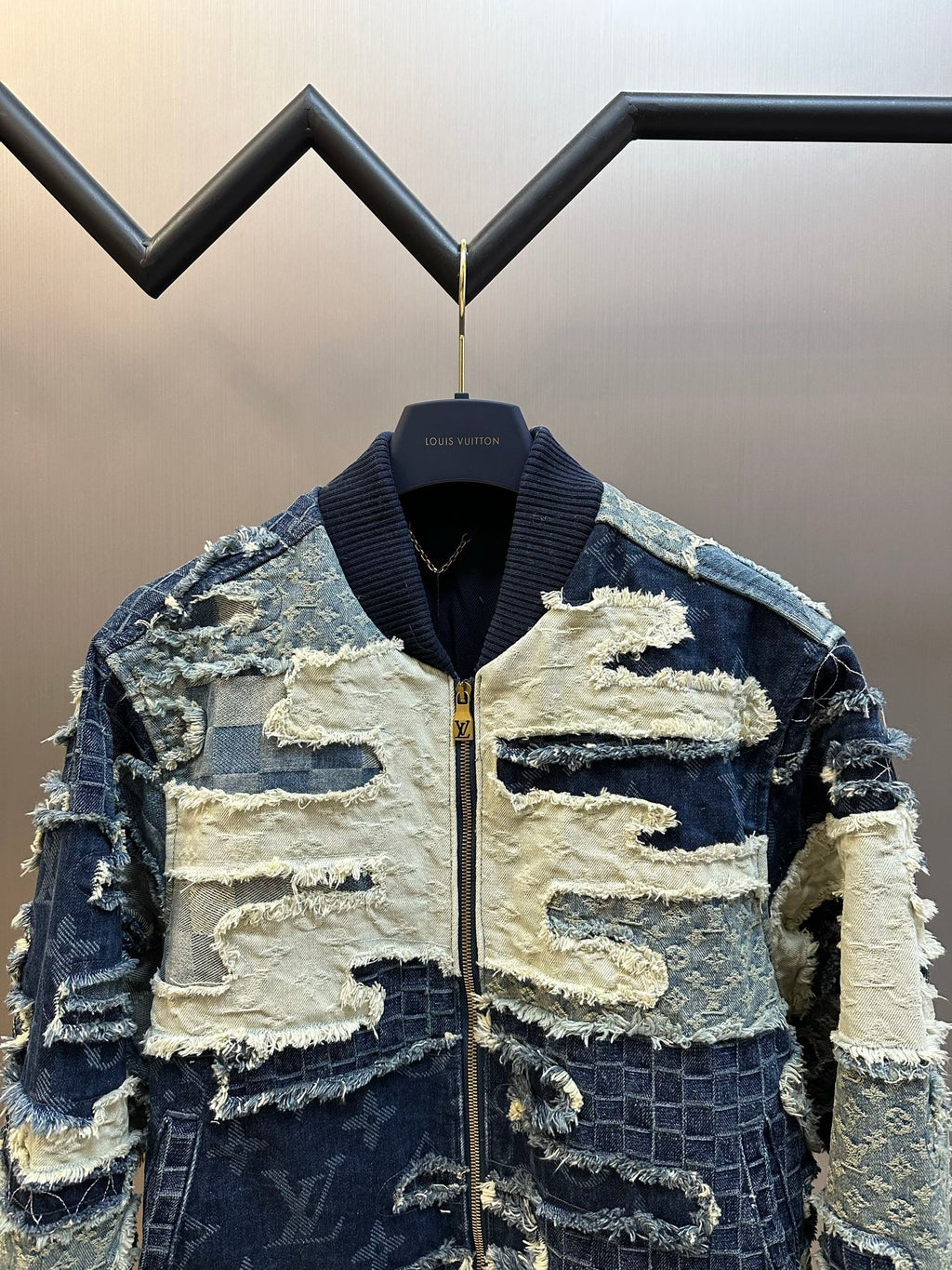 Patchwork denim jacket with stand collar and front zipper, blue-and-cream textured panels
