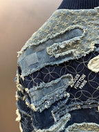Denim jacket detail with distressed seams and frayed trim, Louis Vuitton Paris patch