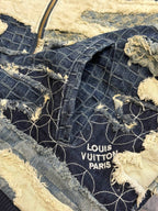 Louis Vuitton Paris label on denim jacket patchwork fabric with embroidered web pattern