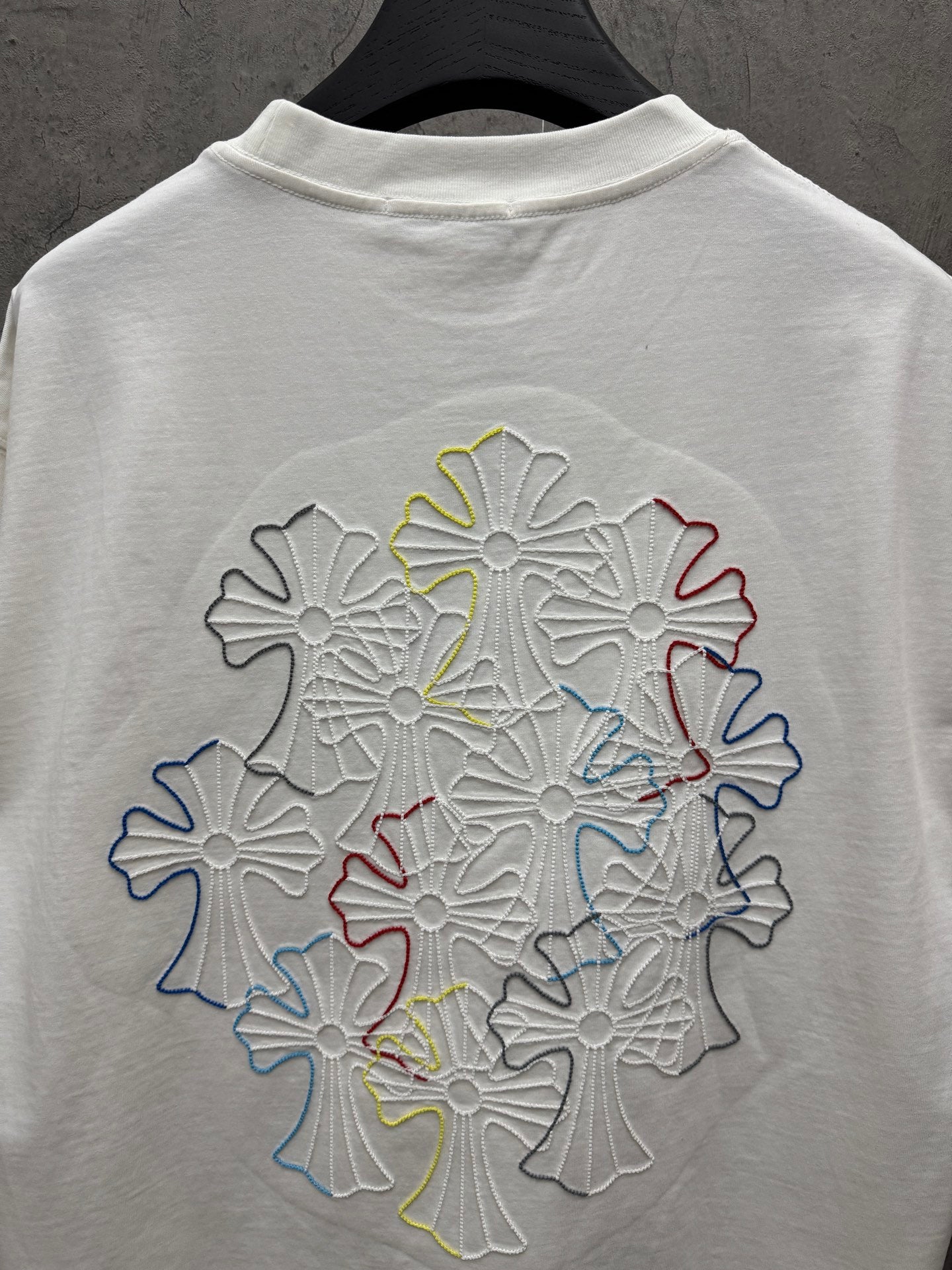 White T-shirt back with large multicolor floral embroidery and crew neck