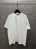 White short-sleeve T-shirt with crew neck and small multicolor floral embroidery