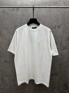 White short-sleeve T-shirt with crew neck and small multicolor floral embroidery
