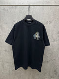 Dark navy short-sleeve T-shirt with small multicolor floral line embroidery on chest