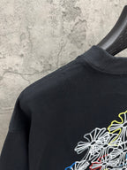 Dark navy short-sleeve T-shirt with multicolor floral line embroidery on back shoulder