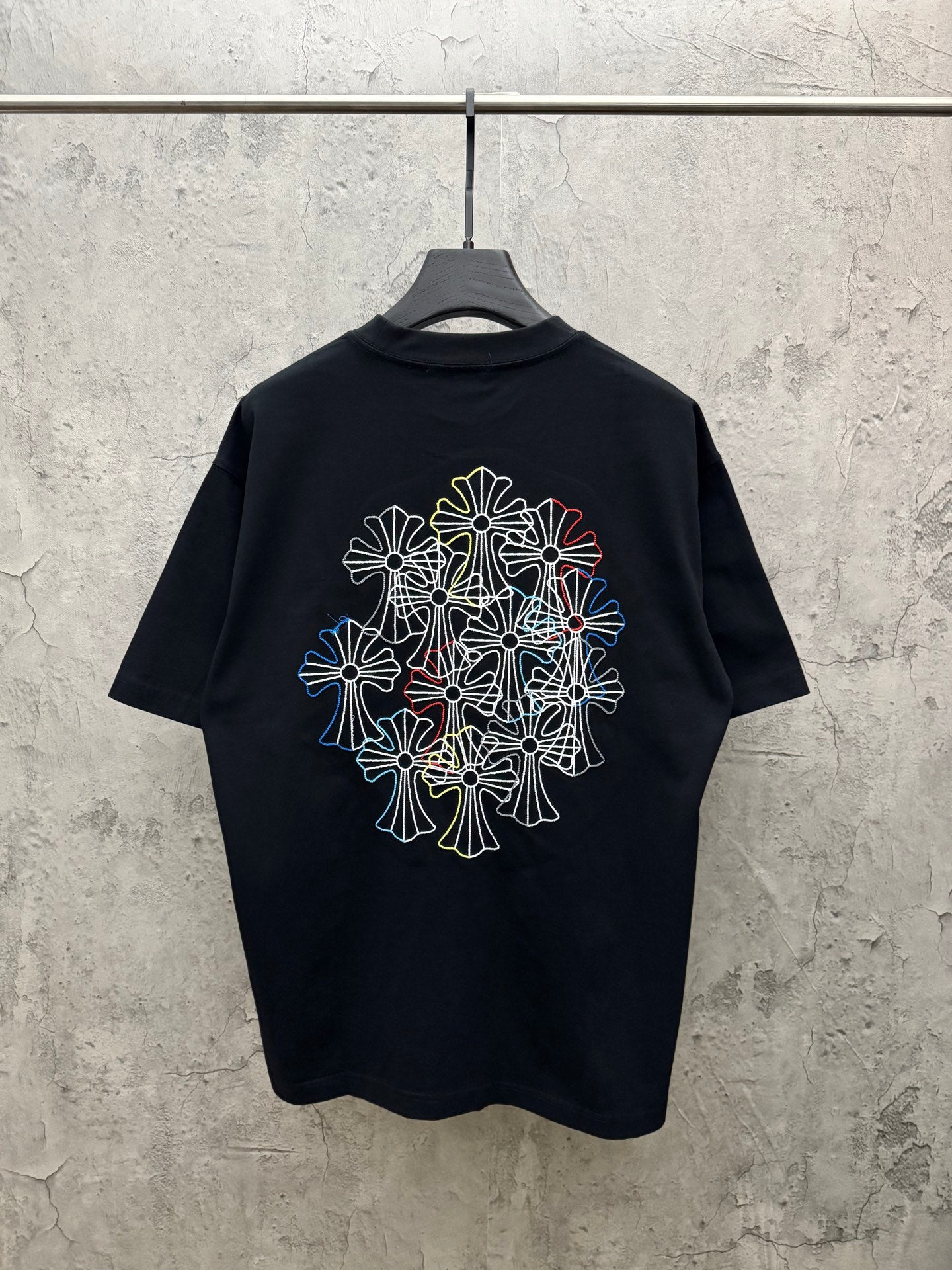 Dark navy short-sleeve T-shirt with large multicolor floral line embroidery on back