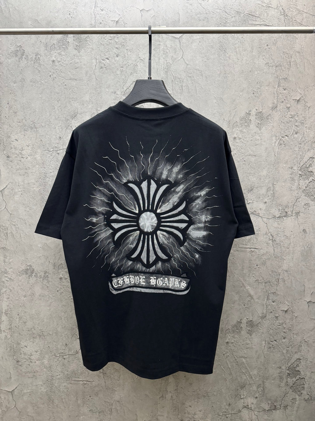 Black short-sleeve T-shirt with large back sunburst graphic and lightning print