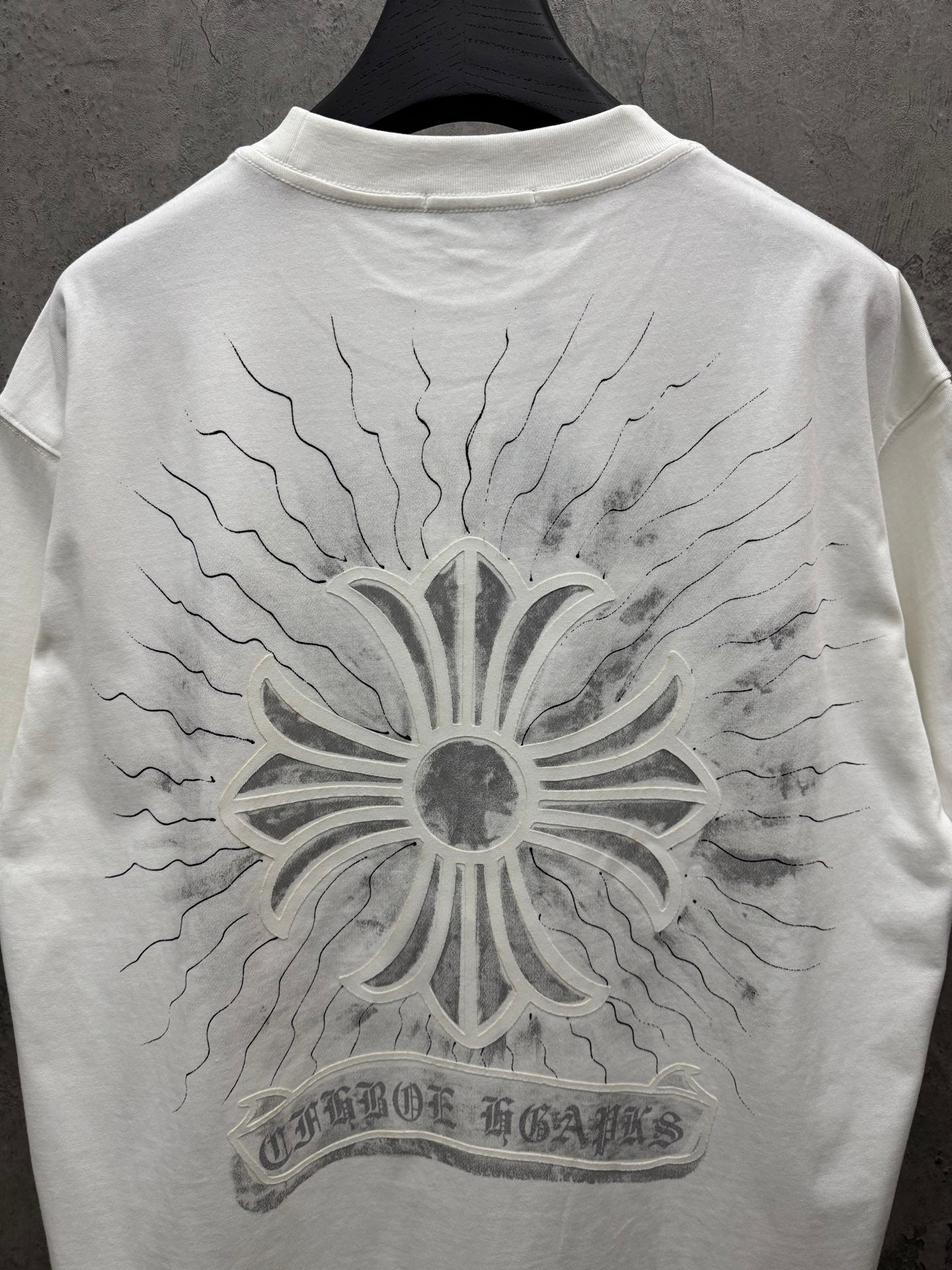 White short-sleeve T-shirt back view with large sunburst floral print