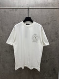 White short-sleeve T-shirt with small chest sunburst floral graphic