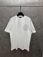 White short-sleeve T-shirt with small chest sunburst floral graphic