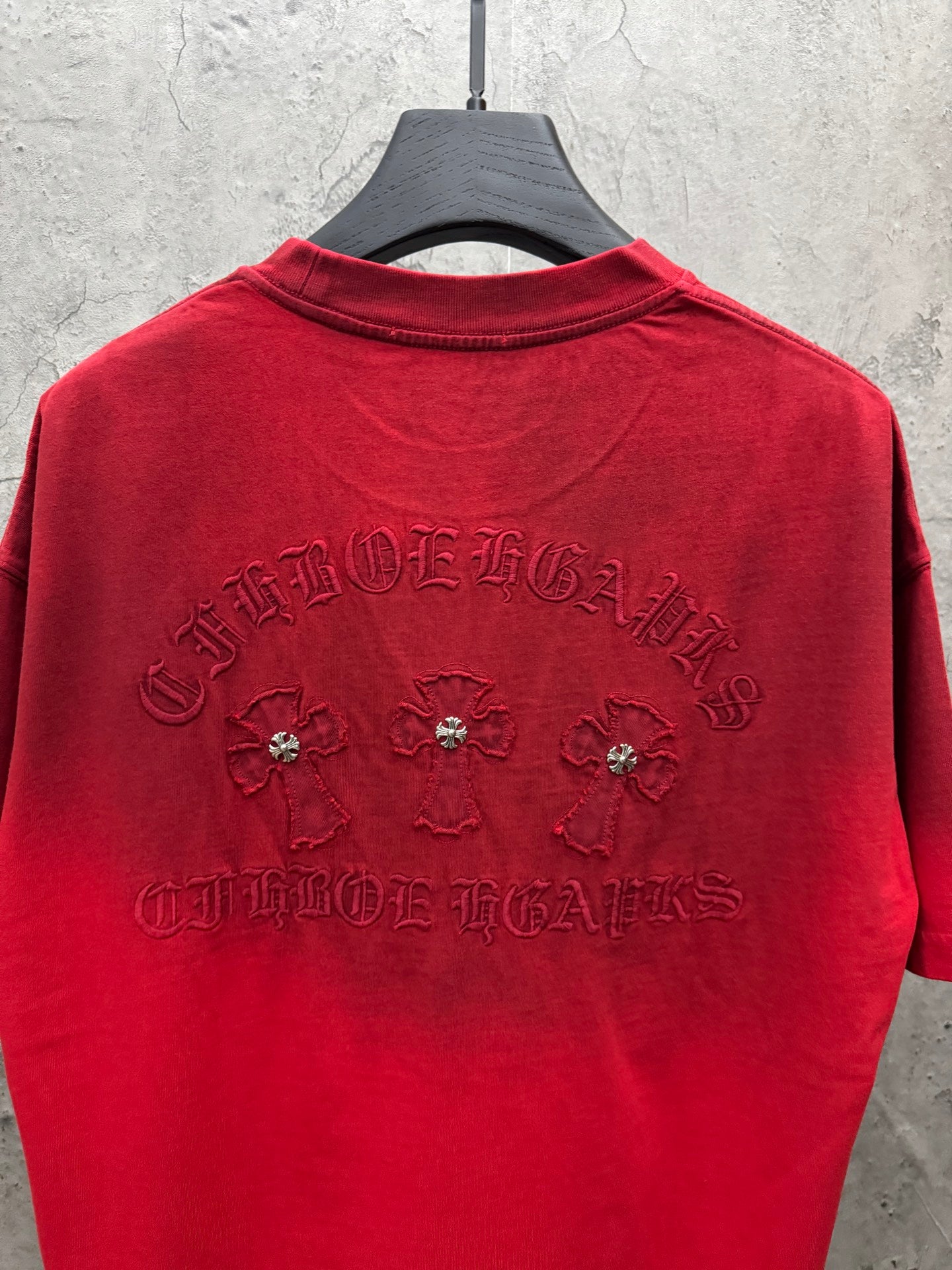 Red T-shirt back with large jeweled and embroidered graphic and lettering