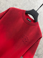 Red T-shirt neckline and shoulder with small rhinestone logo detail
