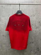 Red graphic T-shirt on hanger, with back jeweled and embroidered lettering