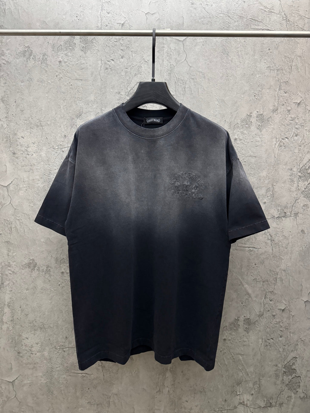 Dark gray crew-neck short-sleeve T-shirt on a hanger