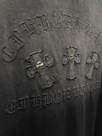 Dark gray T-shirt close-up of raised back graphic with small emblems