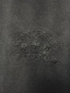 Dark gray fabric texture with raised central logo graphic