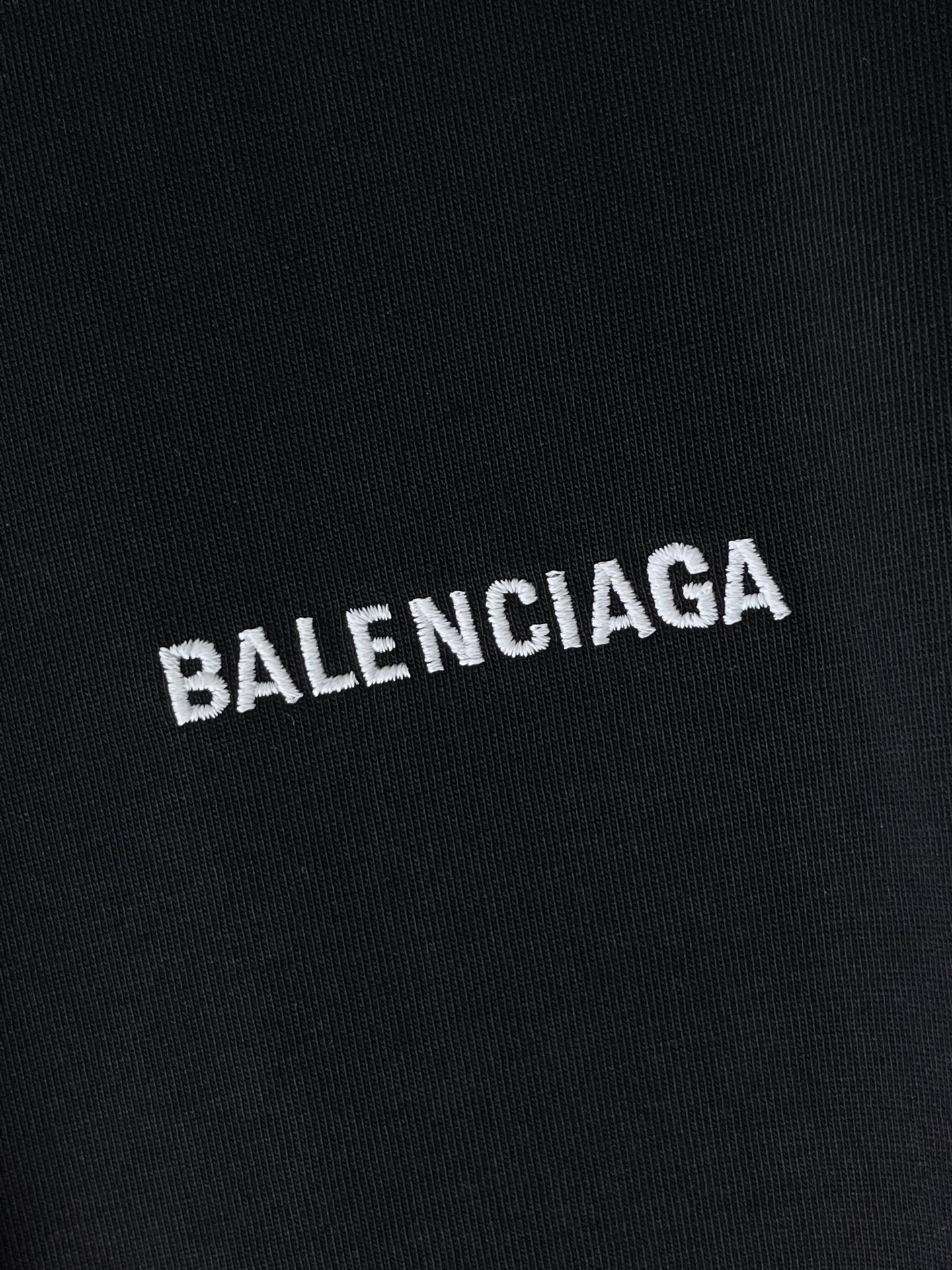 Balenciaga logo graphic on dark navy T-shirt fabric