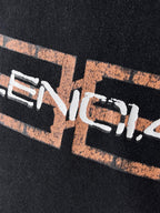 Balenciaga T-shirt, dark fabric, tight close-up of front logo graphic