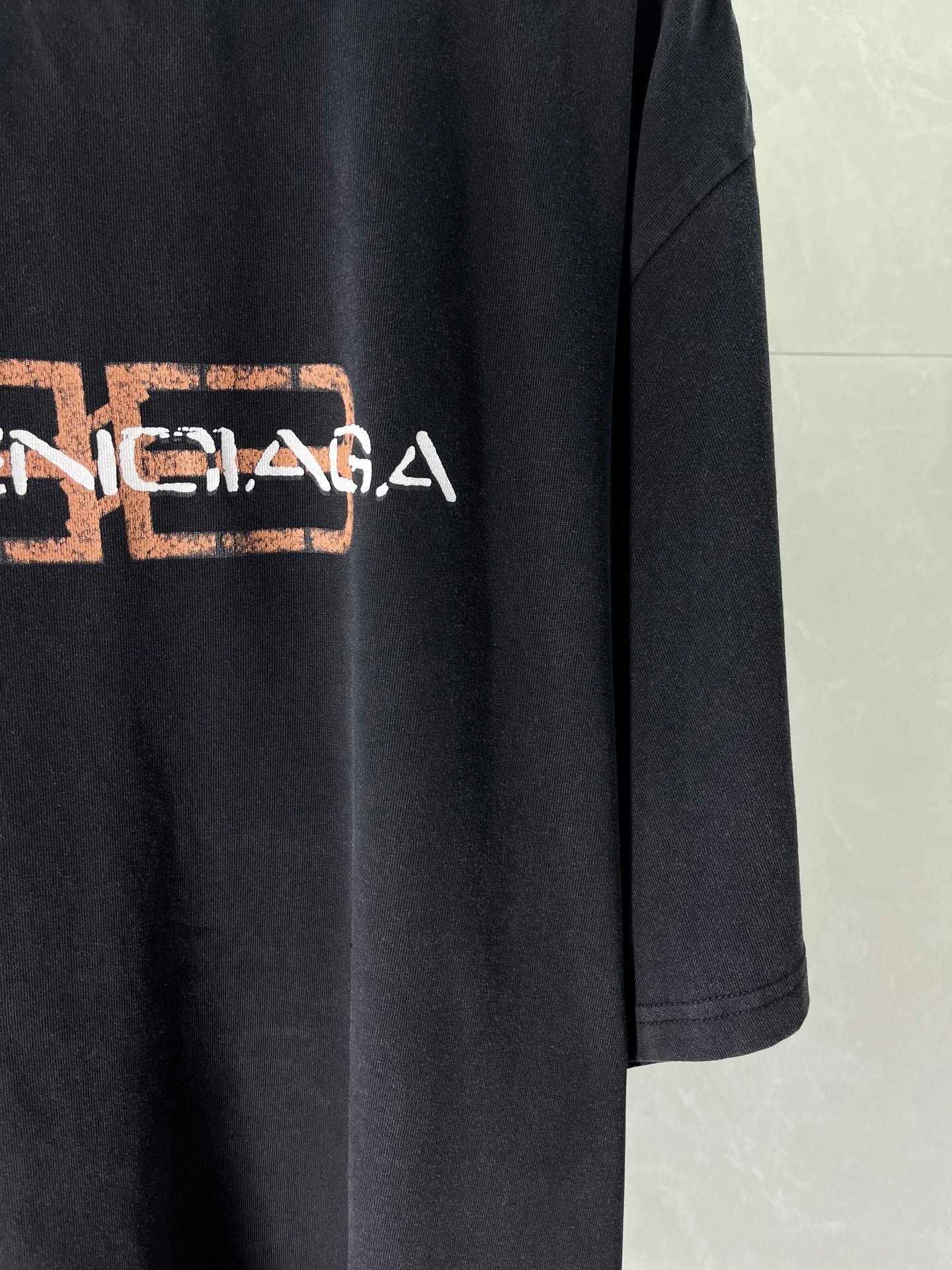 Balenciaga short-sleeve T-shirt, dark fabric with large front logo graphic
