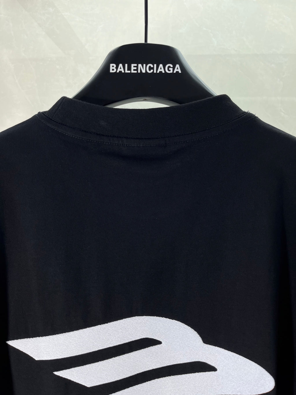 Black Balenciaga T-shirt close-up of large logo on back