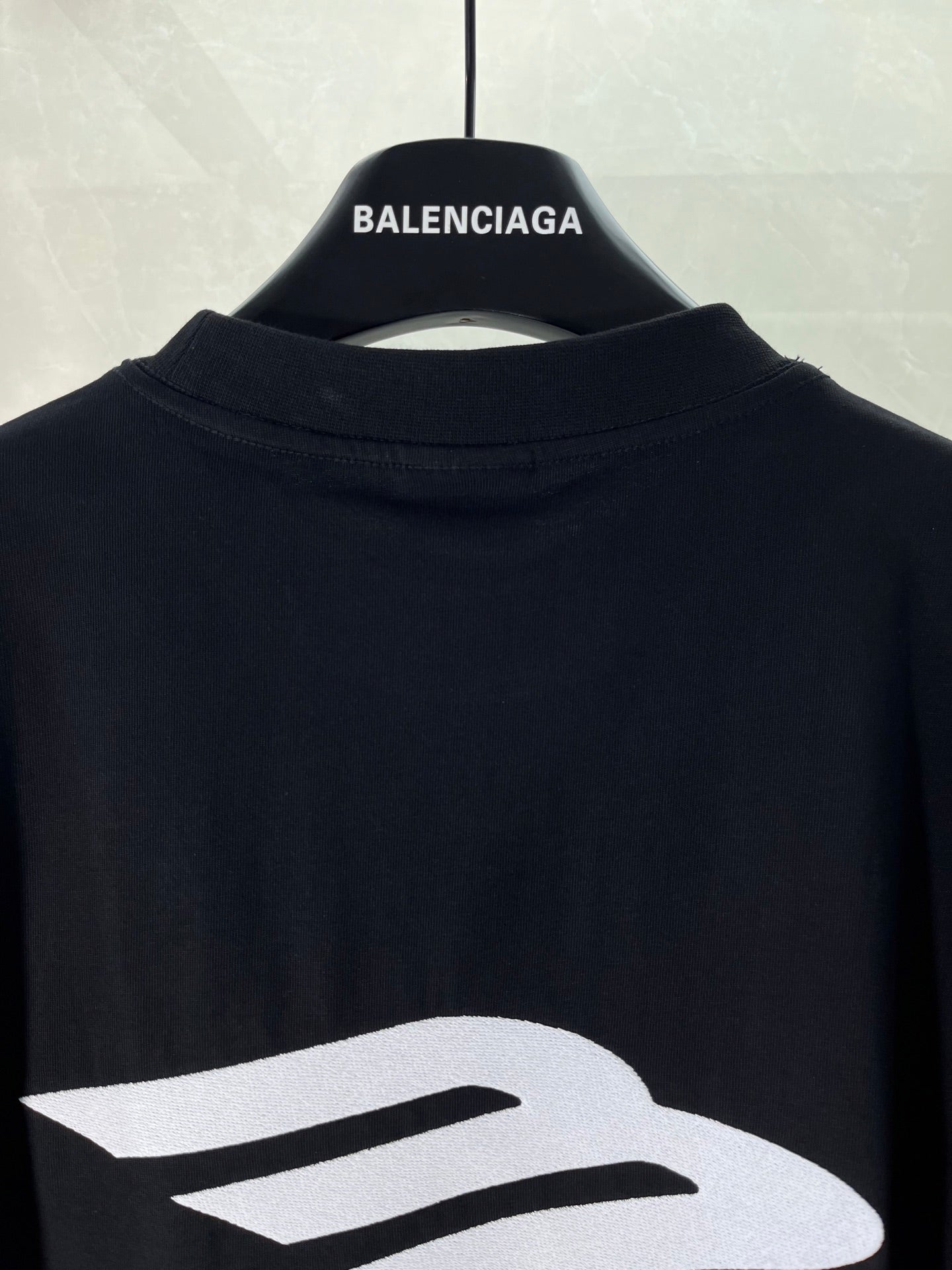 Black Balenciaga T-shirt close-up of large logo on back