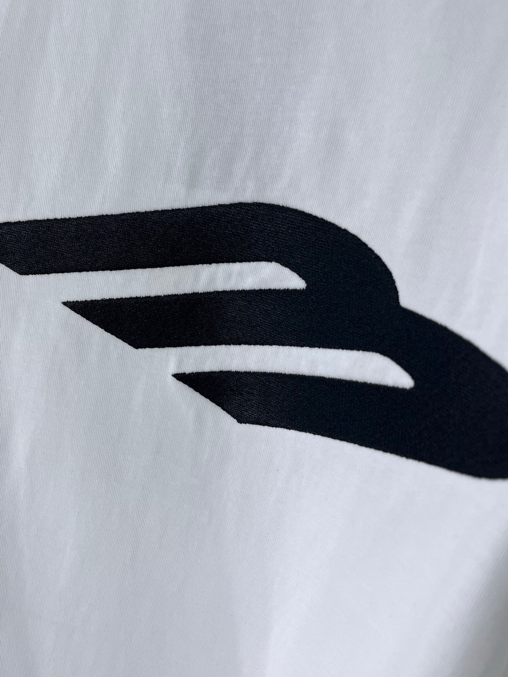 Balenciaga white T-shirt back logo close-up with bold black mark