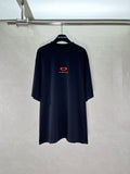 Black T-shirt with small red heart and Balenciaga logo on the chest