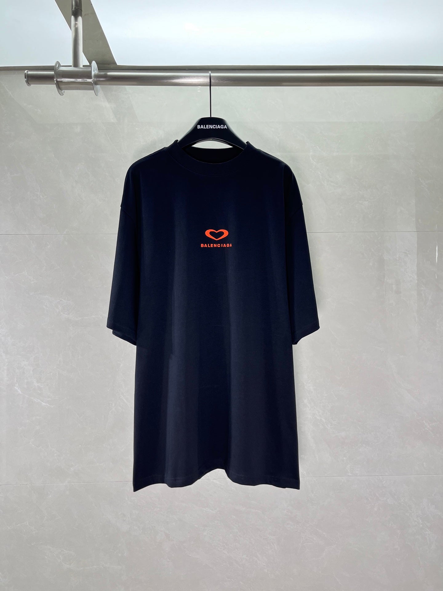 Black T-shirt with small red heart and Balenciaga logo on the chest