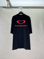 Black T-shirt with large red heart and Balenciaga logo across the chest