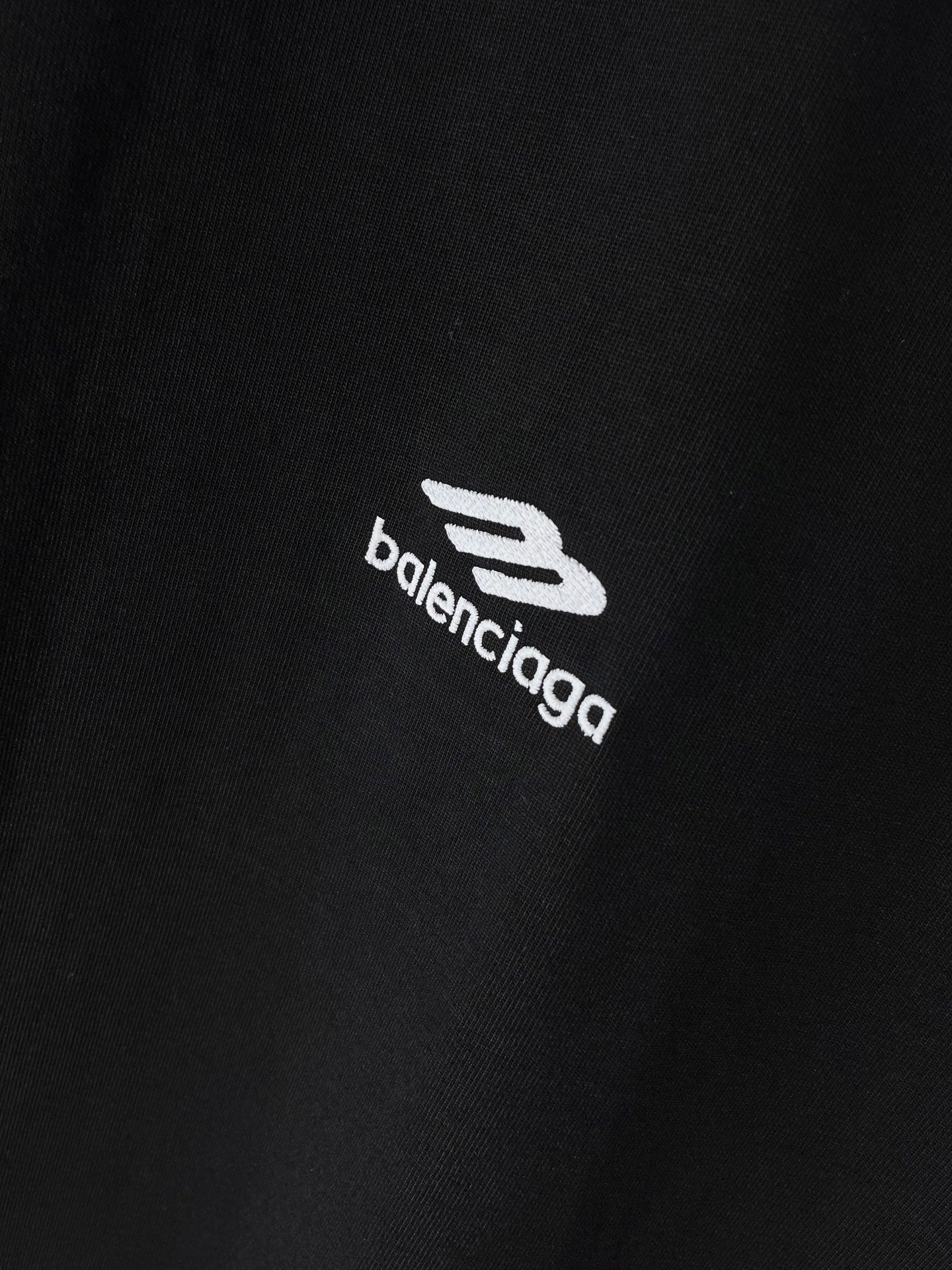 Black Balenciaga T-shirt fabric close-up with logo print