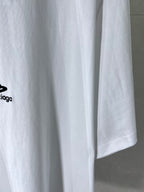 Balenciaga white T-shirt hem close-up with black logo