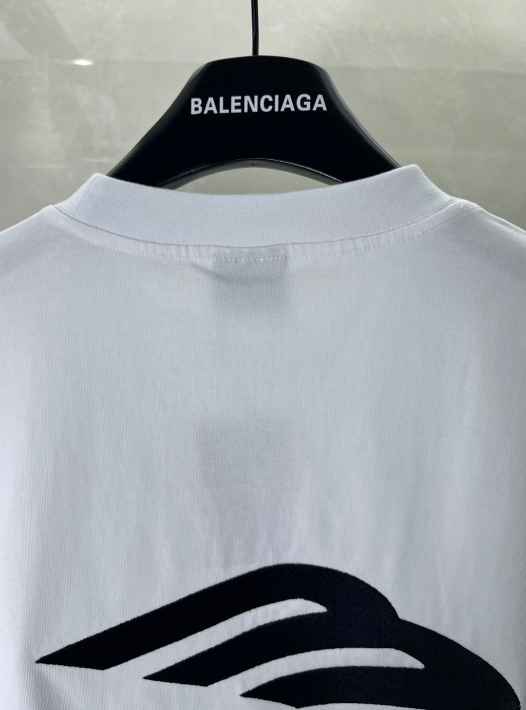 Balenciaga white T-shirt back view on hanger with large logo