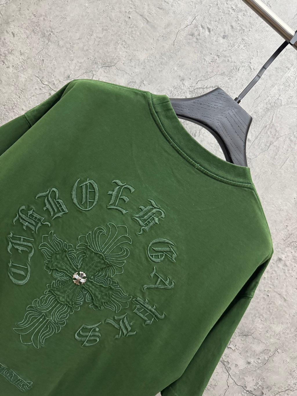 Green crew-neck T-shirt with large embroidered back symbol